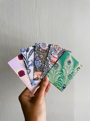 Intricate flora and fauna with gold specks money envelopes for CNY, Eid and Christmas